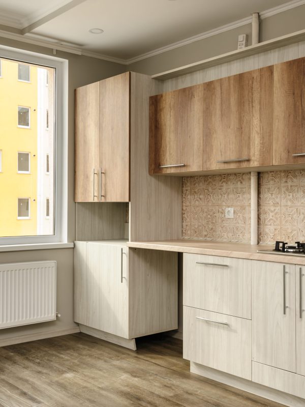 Brand new unfinished yet modern beige kitchen, minimalistic clean design